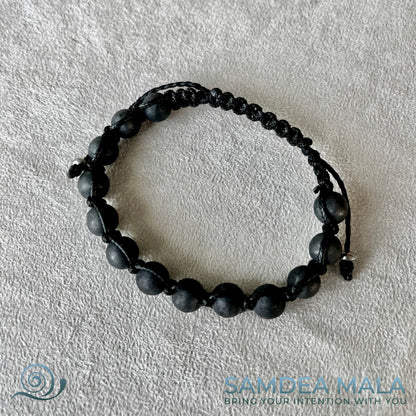 Meditation bracelet with Shungite for energy protection. A black beaded Shaballa bracelet with a black cord. 