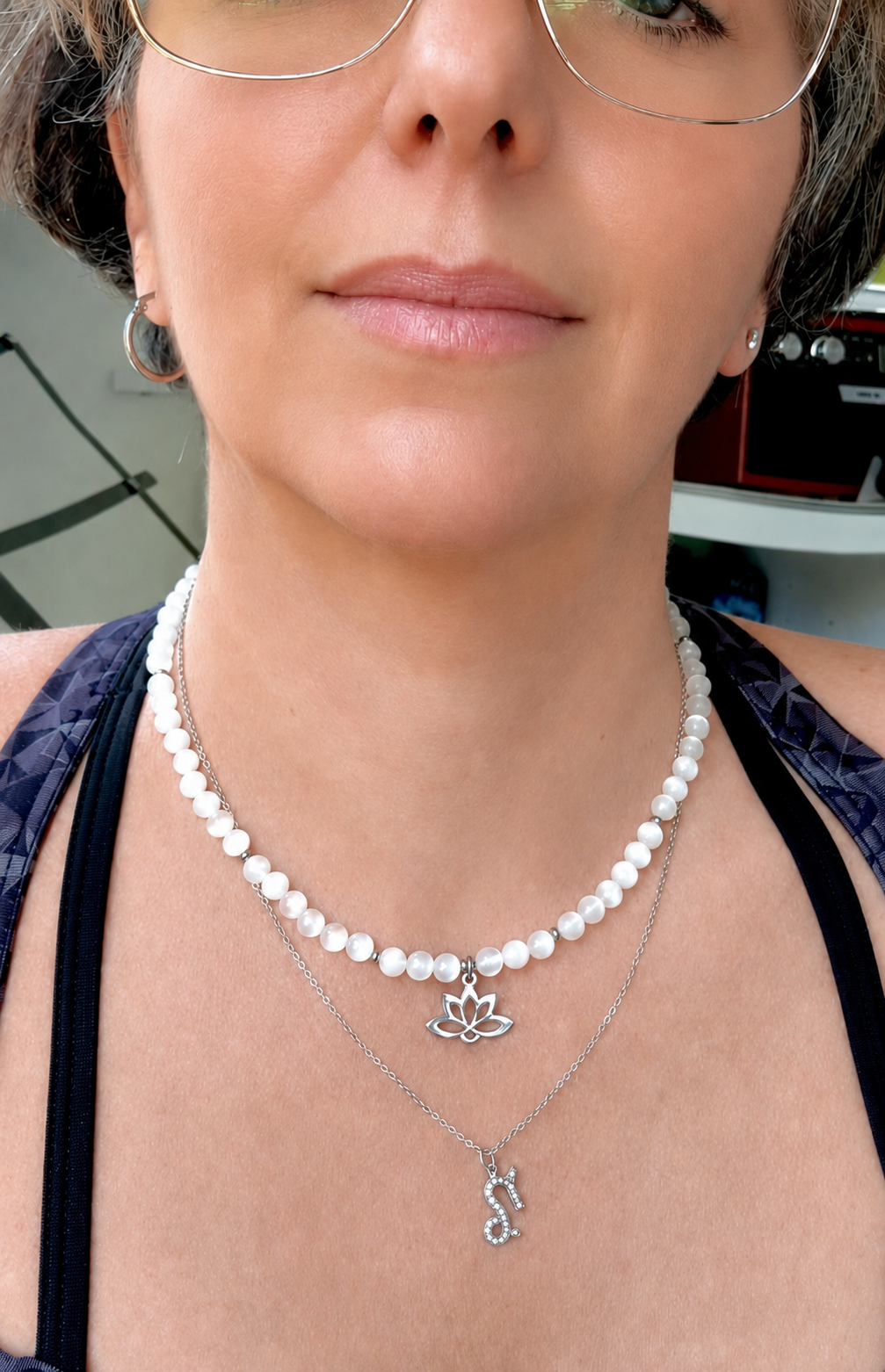 Spiritual selenite choker necklace worn as a talisman for purity and higher connection. Small lotus charm stainless steel.