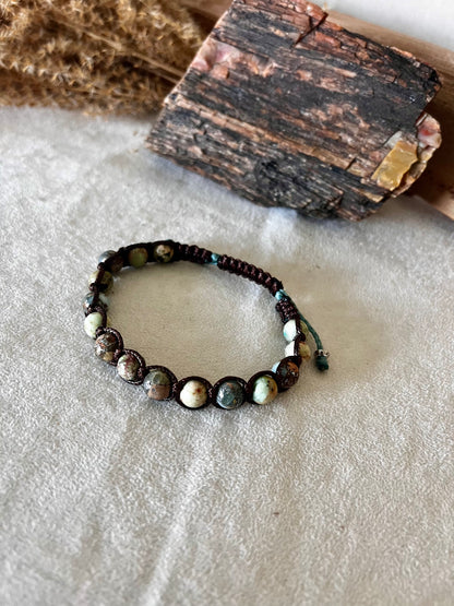 Tibetan bracelet in Aqua Jasper for calm and healing. A meditation mala bracelet and spiritual jewelry piece designed to support your personal intentions and inner peace.