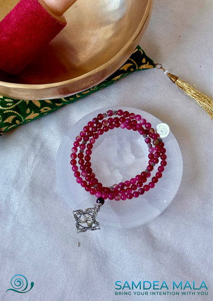Samdea Mala necklace in watermelon tourmaline for heart chakra healing. Heart chakra mala beads necklace with OM and lotus charm. Mala for Meditation for women with watermelon tourmaline and garnet for heart protection and clarity with Anahata chakra pendant.