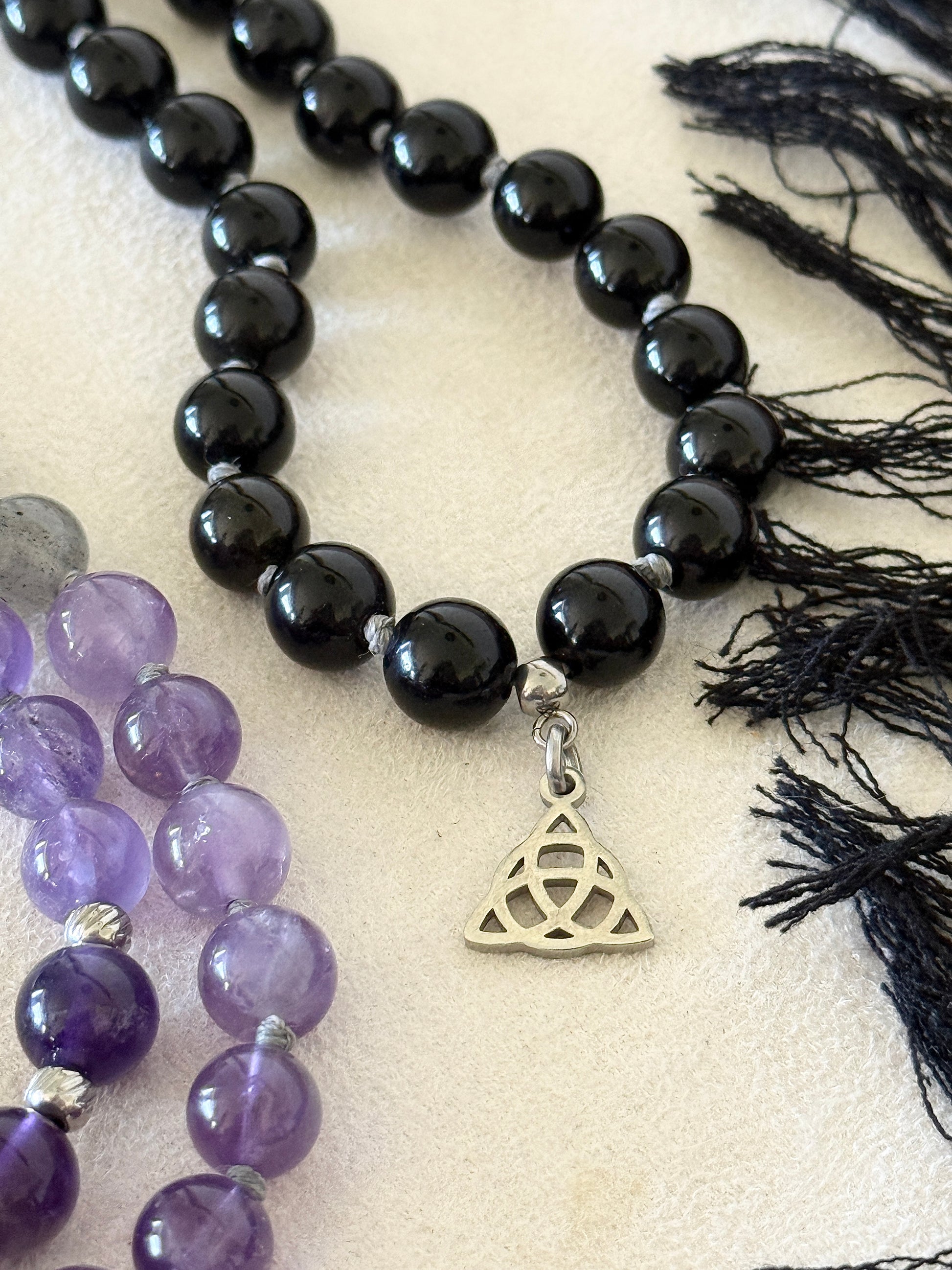 Shadow Work Mala with black tassel, Triquetra charm and Om Mani Padme Hum mantra bead