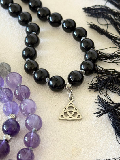 Shadow Work Mala with black tassel, Triquetra charm and Om Mani Padme Hum mantra bead