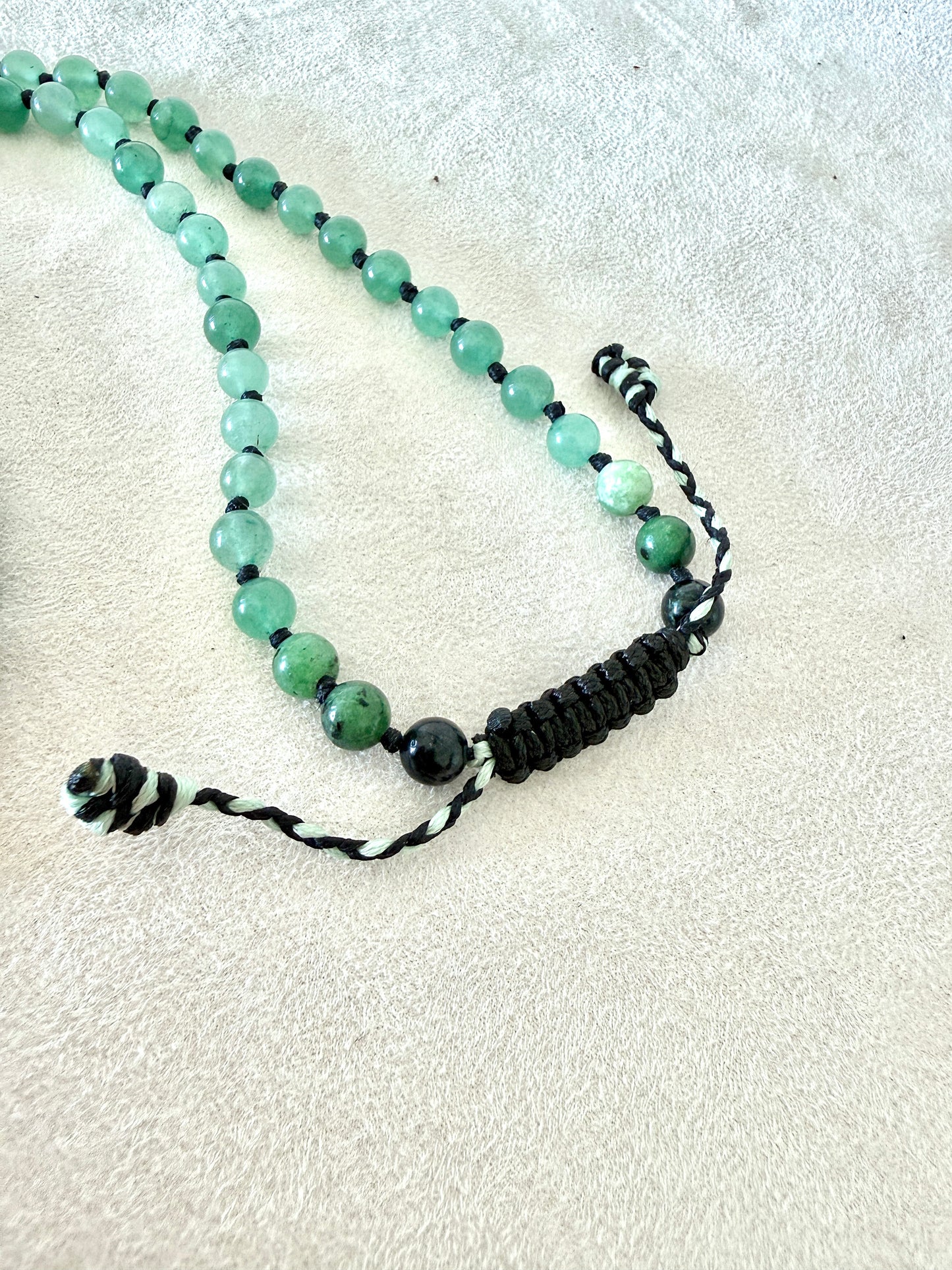adjustable macramé closure, of a zoisite with ruby, aventurine  green mala bracelet with 100% natural gemstones, stainless steel turtle charm and 108 bead mala necklace design for yoga, meditation, gentle growth, protection, and spiritual transformation. 