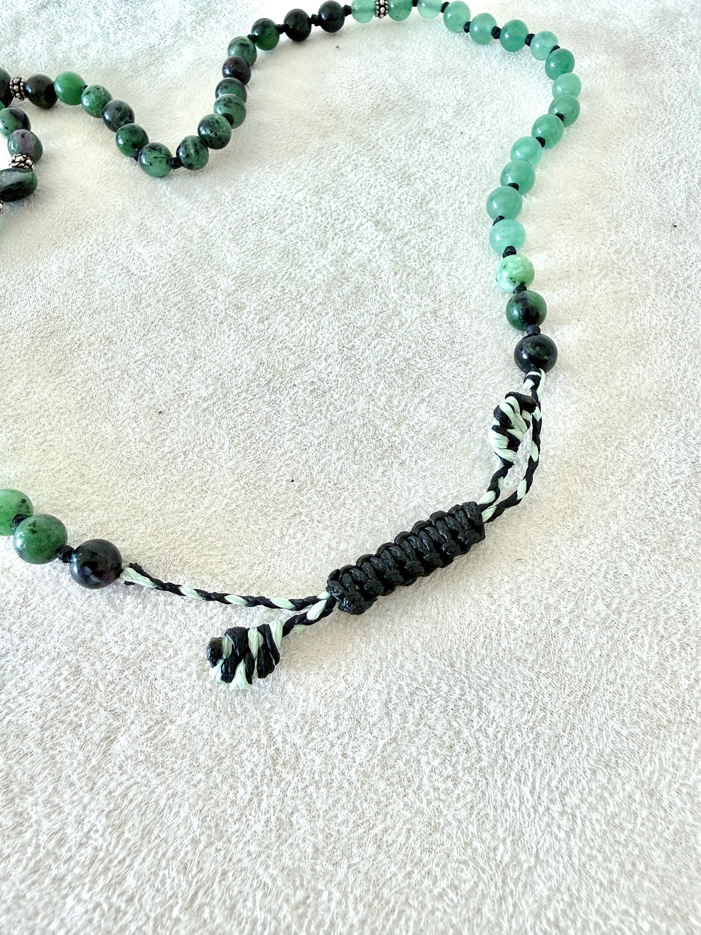 adjustable macramé closure, of a zoisite with ruby, aventurine  green mala bracelet with 100% natural gemstones, stainless steel turtle charm and 108 bead mala necklace design for yoga, meditation, gentle growth, protection, and spiritual transformation. 
