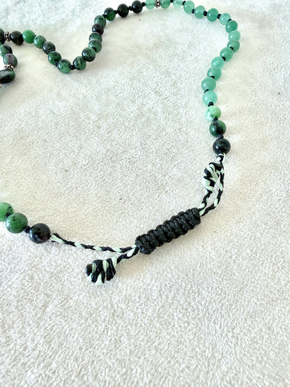 adjustable macramé closure, of a zoisite with ruby, aventurine  green mala bracelet with 100% natural gemstones, stainless steel turtle charm and 108 bead mala necklace design for yoga, meditation, gentle growth, protection, and spiritual transformation. 