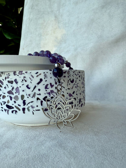 Detail: guru bead and tassel on amethyst white jade meditation mala