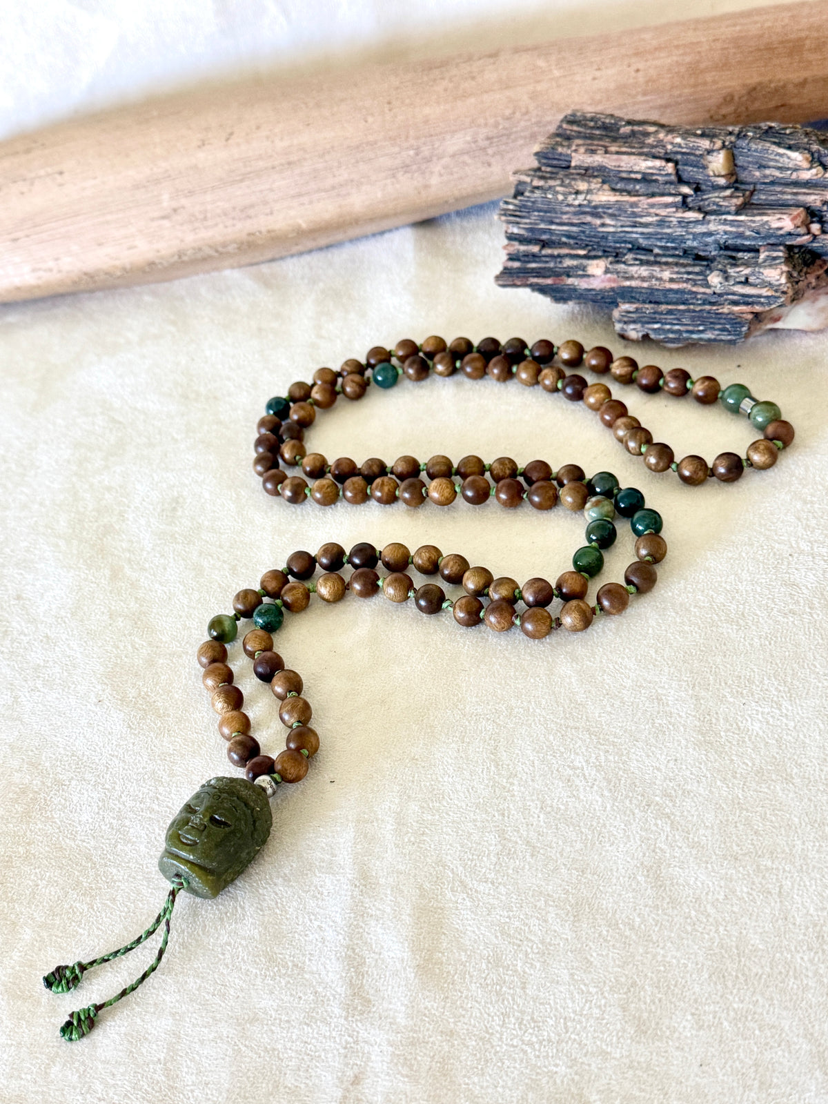 Full-length view of the 108-bead sandalwood and Indian agate mala necklace