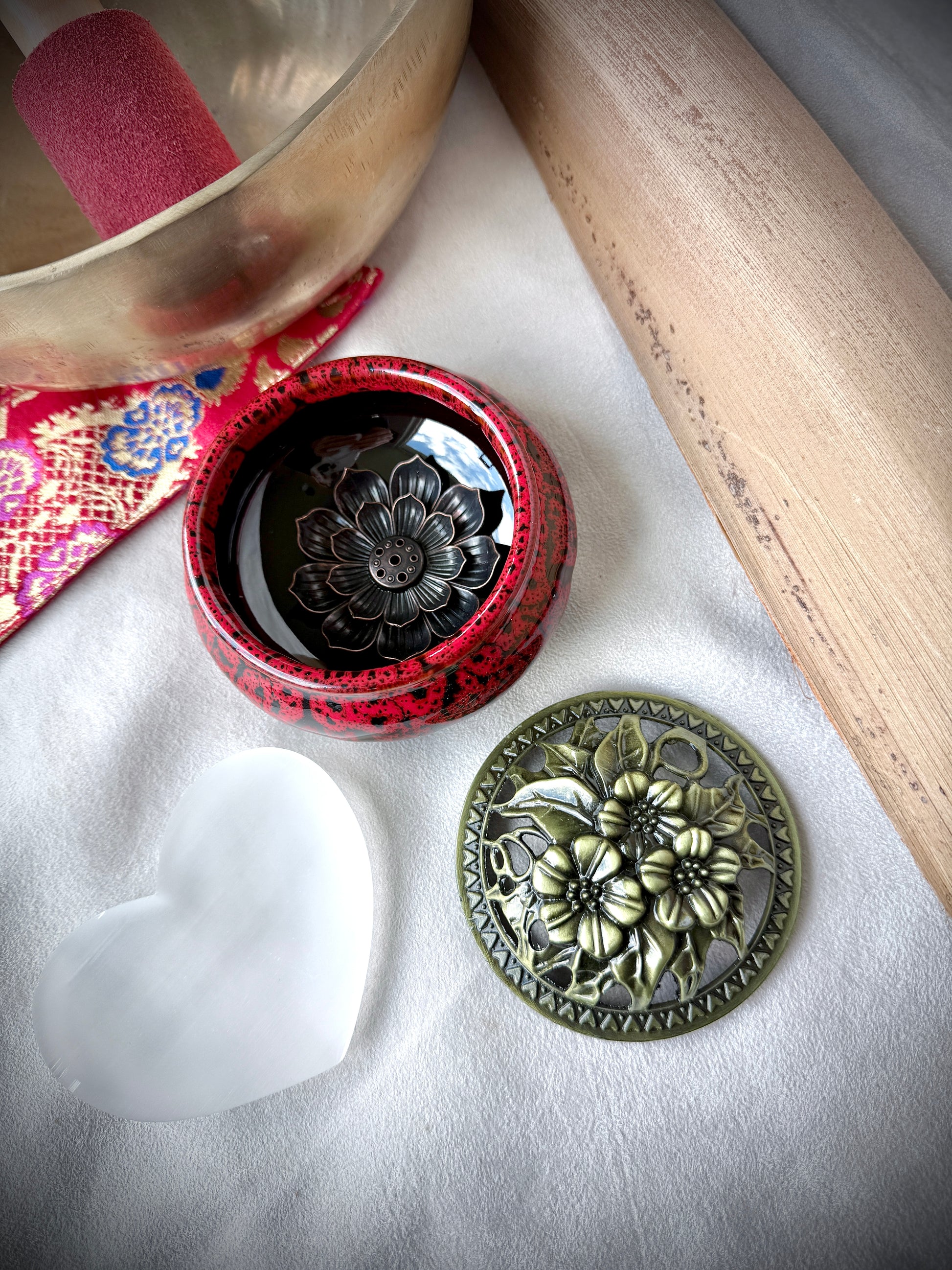 Small round ceramic bowl in deep red glaze with a removable golden metallic lid, artisanal tabletop decor. - Samdea Mala