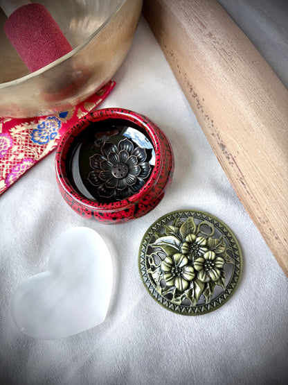 Small round ceramic bowl in deep red glaze with a removable golden metallic lid, artisanal tabletop decor. - Samdea Mala