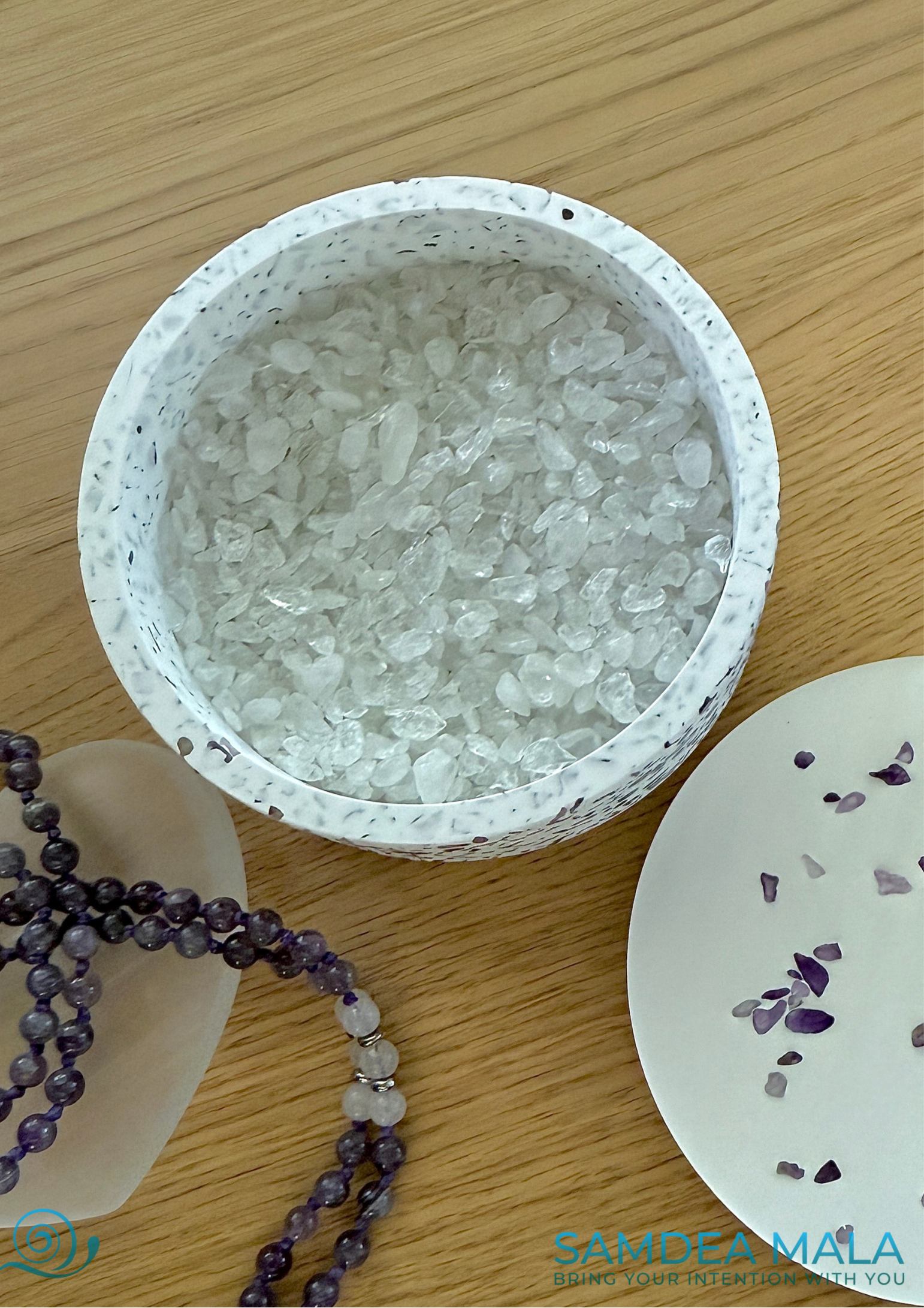 Close-up of bowl with clear quartz and amethyst crystals for energy cleansing