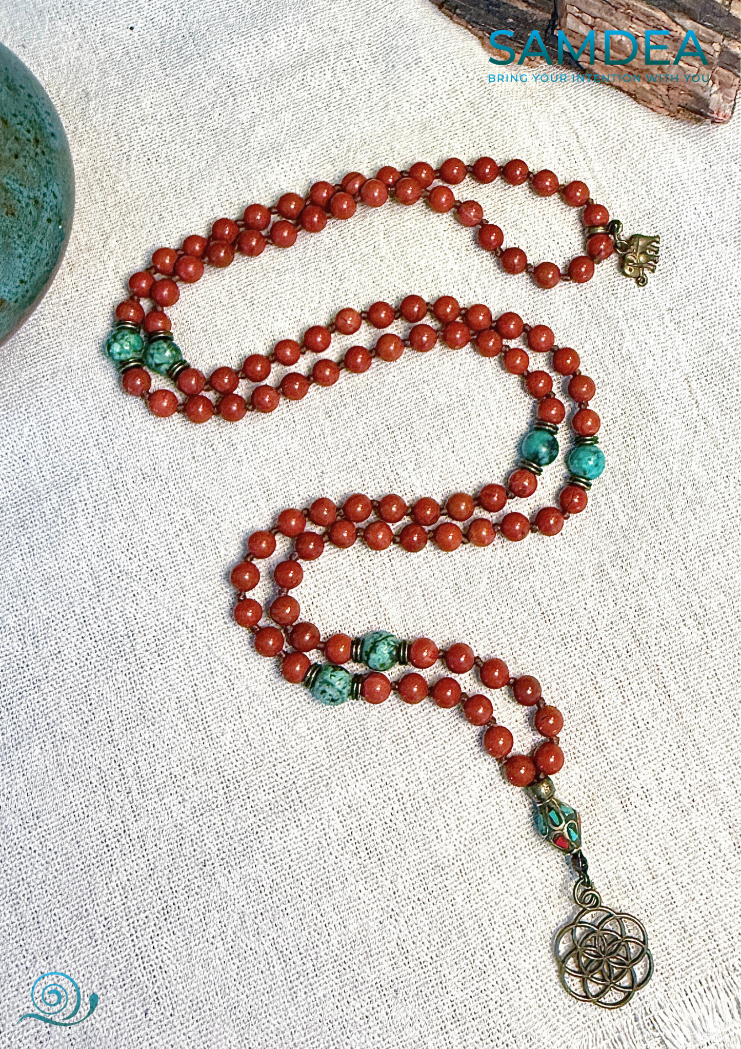 full view of Mala necklace with Red Jasper and African Turquoise, hand-knotted with 108 beads for meditation and personal growth. Spiritual jewelry for grounding, strength, and transformation. Seed f life pendant.