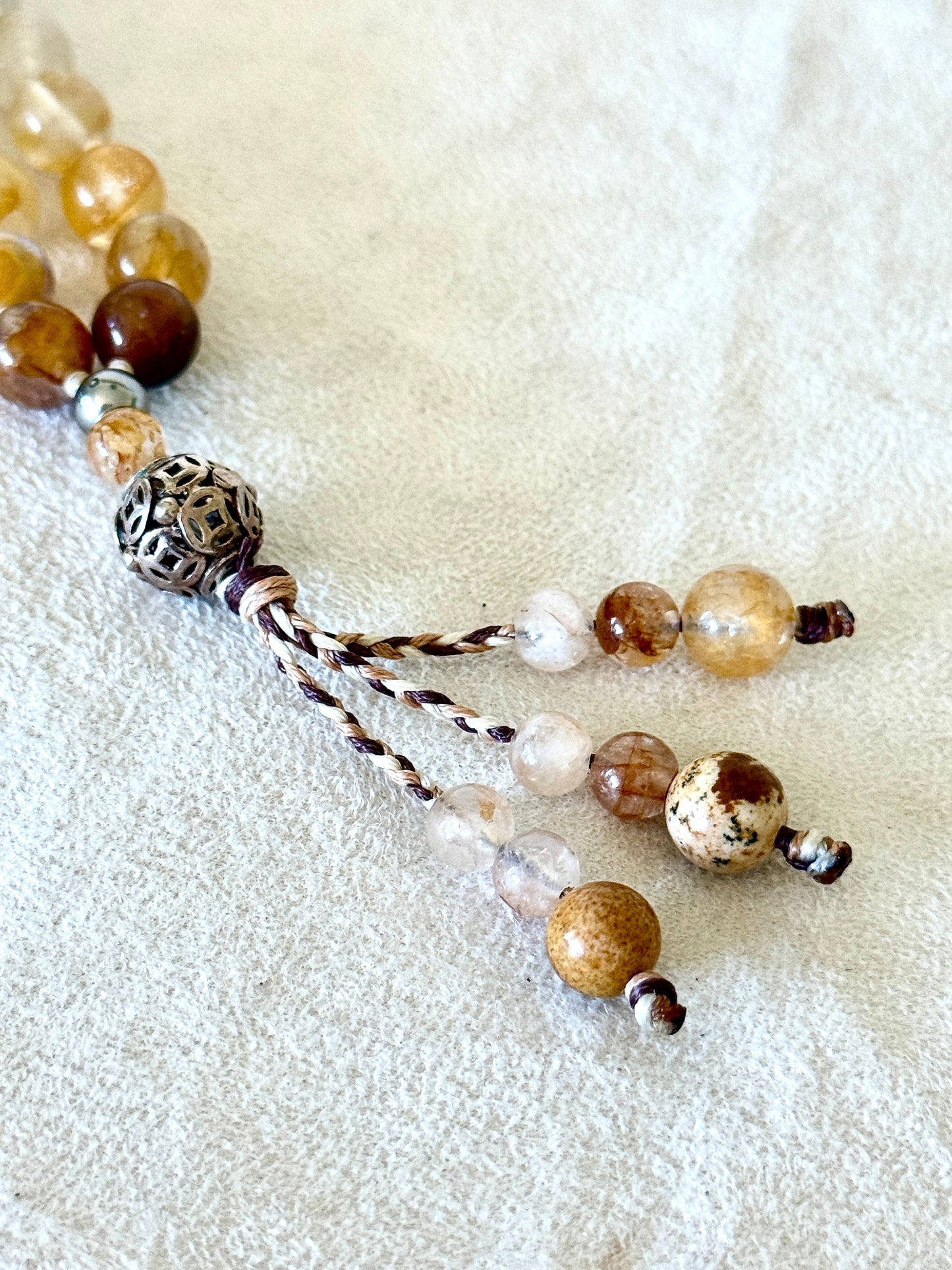 tassel of gemstones on a108 bead hematoid quartz and sand jasper mala for meditation with soapberry seeds and sterling silver details, handmade mala necklace by Samdea