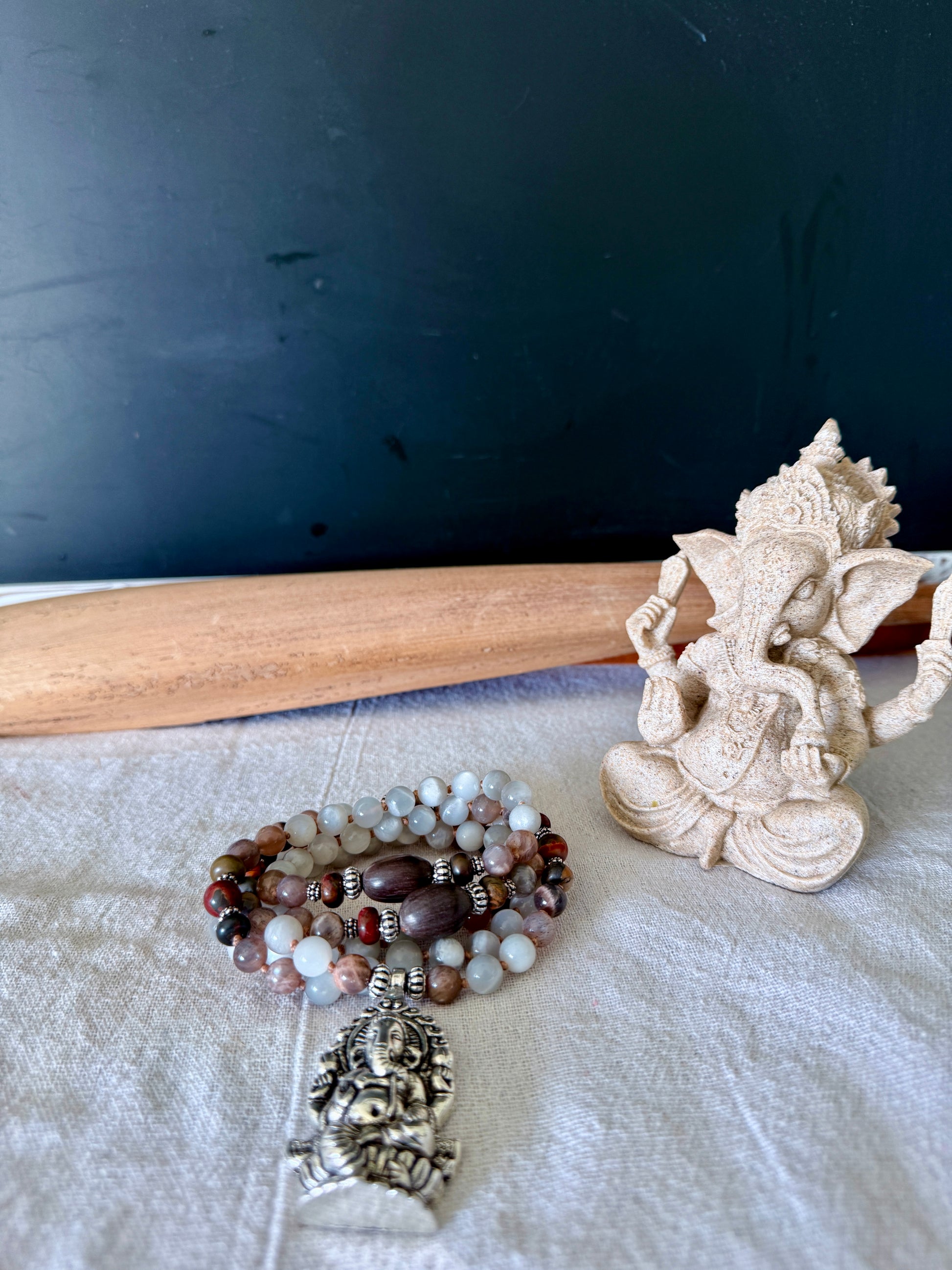 108 prayer beads mala dedicated to Om Gam Ganapataye Namaha with Ganesha pendant and lotus seeds