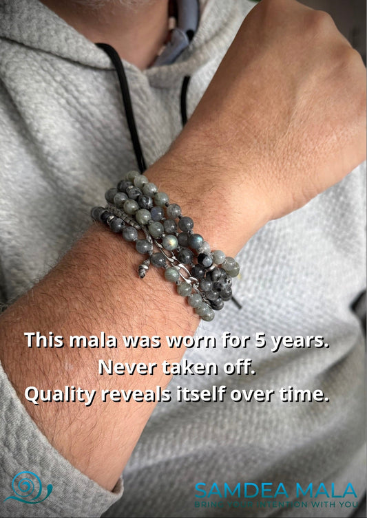 Samdea Mala multi-loop bracelet in labradorite with a steel Buddha head charm – 108 prayer beads, handmade spiritual jewelry with grey-blue natural stones for intuition and inner vision.
