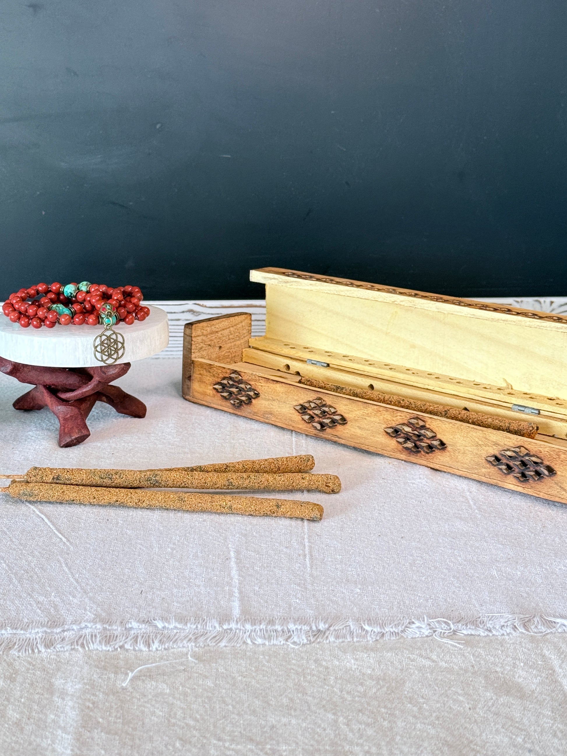 Masala natural incensePlant-based artisan incense sticks hand-rolled in India, natural non-toxic ingredients. Resin rolled incense stick texture detail showing herbal blend and artisan hand rolled Nag Champa tradition