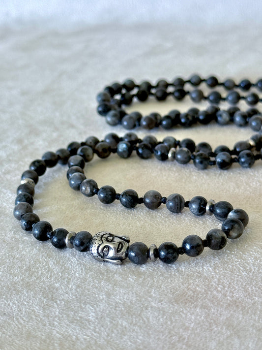 Grey larvikite wrap bracelet laid flat, coiled with a stainless steel Buddha charm bead
