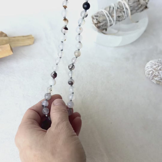 close-up of Handmade mala beads necklace in Dendritic Agate, Black Tourmaline, and Lava Stone for protection and balance. Gemini Zodiac Sign Mala by Samdea Mala