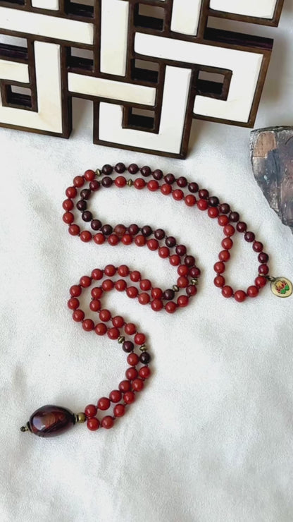 Video of red jasper mala necklace with tiger iron pendant, grounding mala, man mala, chakra mala beads
