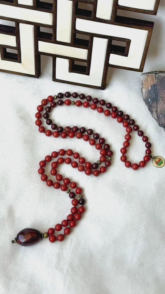 Video of red jasper mala necklace with tiger iron pendant, grounding mala, man mala, chakra mala beads