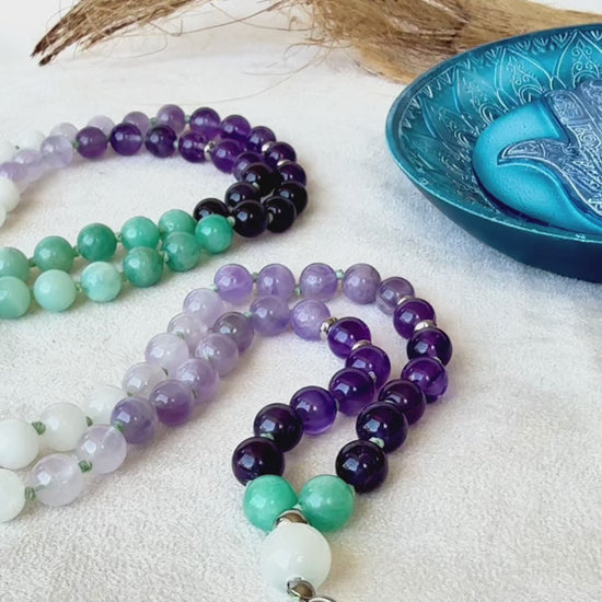 Video preview of Samdea Mala for letting go and emotional healing – 108 bead necklace with amethyst, amazonite and jade. Mala for Pisces Zodiac Sign. Buddha charm, seed of life pendant and lotus charm