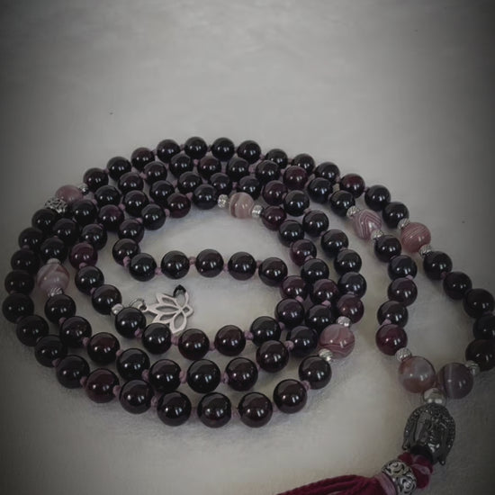 Video preview of Samdea Mala Custom mala with tassel; mala necklace in purple, bordeaux mala beads with Buddha and lotus charm, for protection and light.