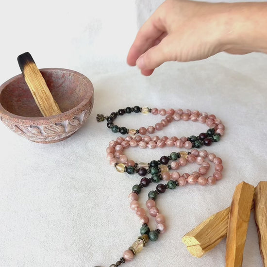Video preview of Sun Mala for meditation with Sunstone, Citrine, Garnet, and Jasper with seed of life pendant, for energy and light in your spiritual journey of mindfullness, 108 mala necklace