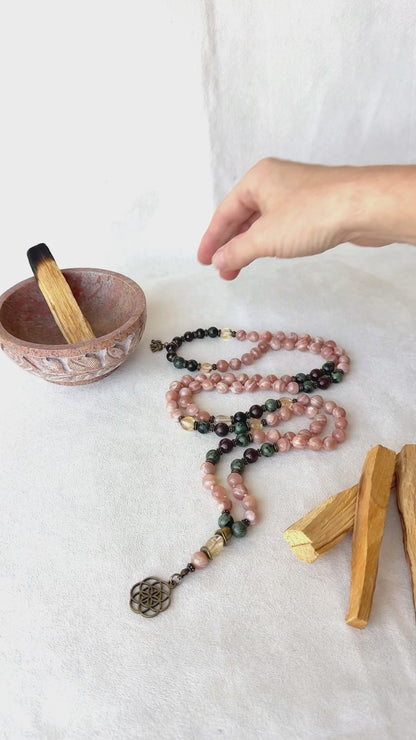 Video preview of Sun Mala for meditation with Sunstone, Citrine, Garnet, and Jasper with seed of life pendant, for energy and light in your spiritual journey of mindfullness, 108 mala necklace