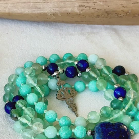 Video preview of Handmade 108 mala beads with blue and green gemstones – sacred tool for mindfulness. Zodiac Sign Virgo mala for meditation. Unalome Lotus charm