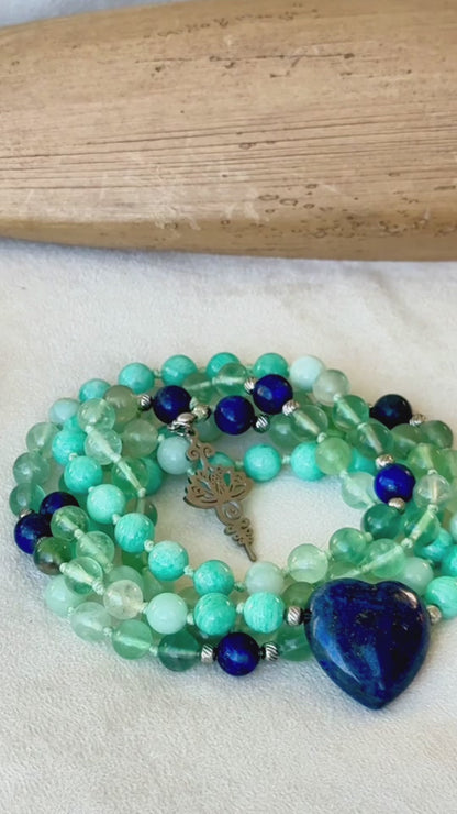 Video preview of Handmade 108 mala beads with blue and green gemstones – sacred tool for mindfulness. Zodiac Sign Virgo mala for meditation. Unalome Lotus charm