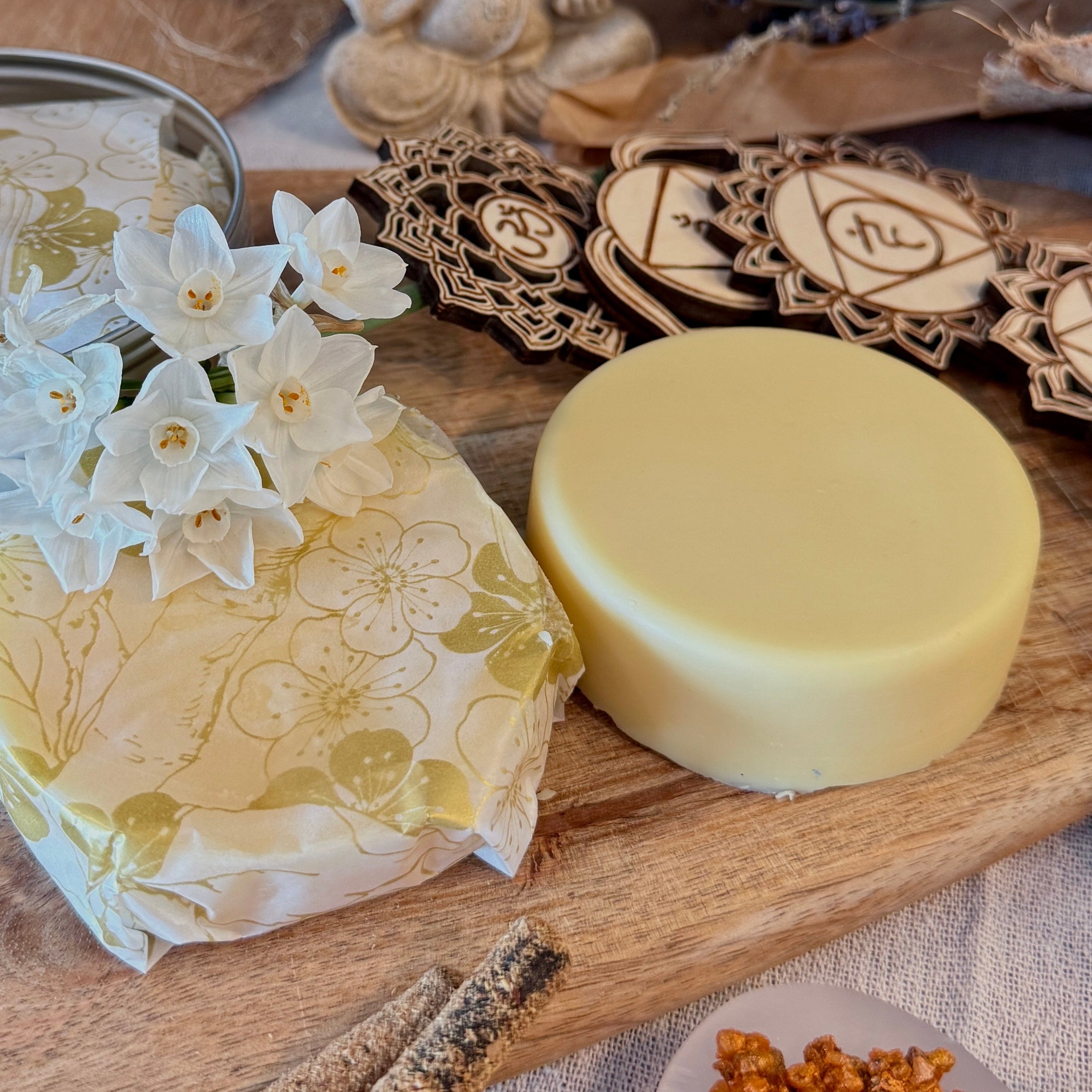 ritual body butter Samdea, organic, ethically source ingredients, natural fragrances, natural essential oil on wood with gemstones.Jasmine flowers, lavender and sandalwood.