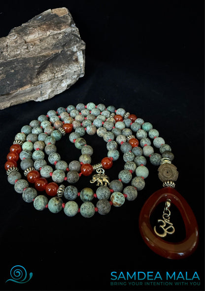 108 mala necklace with African turquoise beads and red gemstone beads. Handmade in US mala for meditation and intention setting. Small OM charm and a small elephant charm.  Mala necklace,  Custom mala beads, 108 prayer beads, Custom mala, 
